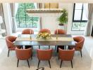 Elegant dining room with large windows and chandelier