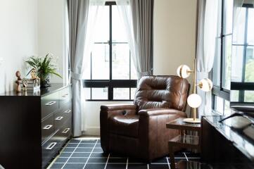 Cozy living room with leather armchair and modern decor