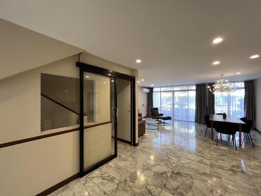 Modern living space with dining area and large windows