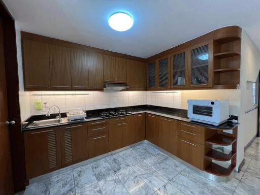 Well-furnished kitchen with modern appliances