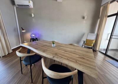 Modern dining area with wooden table and chairs