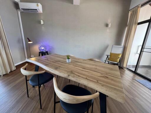 Modern dining area with wooden table and chairs