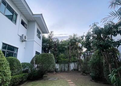 Side view of a house with garden