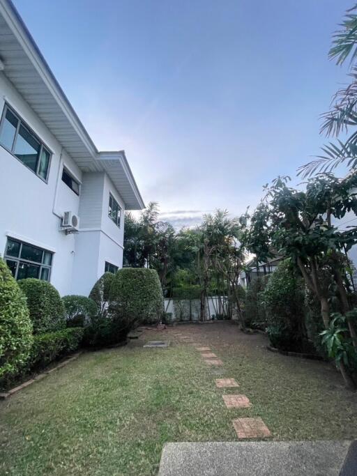 Side view of a house with garden