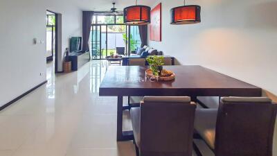 Spacious modern living room with dining area and large windows