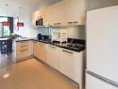 Modern kitchen with appliances and dining area