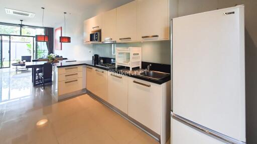 Modern kitchen with appliances and dining area