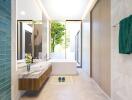 Modern bathroom with bathtub, wooden cabinets, and a large window