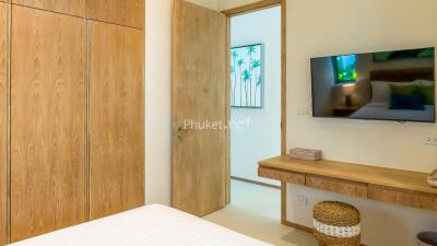 Cozy Bedroom with Wooden Furniture and Wall Art