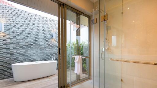 Modern bathroom with outdoor tub view