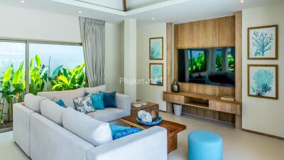 Modern living room with large sectional sofa and wall-mounted TV