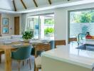 Modern kitchen and dining area with natural light and garden view