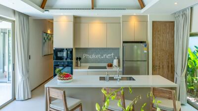 Modern kitchen with island and stainless steel appliances