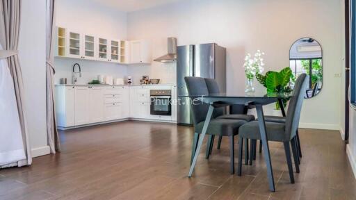 Modern kitchen and dining area with stainless steel appliances