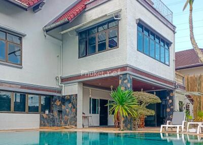 Two-story residential building with pool