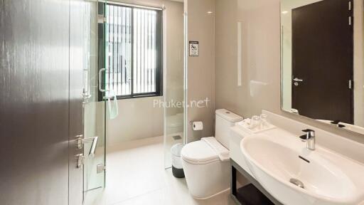 Modern bathroom with large mirror and glass shower