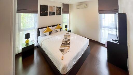 Spacious bedroom with a large bed and modern decor