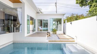 Modern house with outdoor pool and patio