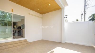 Outdoor patio area with sliding glass door