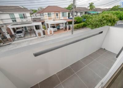 Modern balcony with tiled flooring and street view