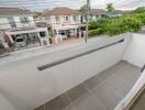 Modern balcony with tiled flooring and street view