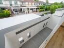 View of a small balcony with neighborhood street