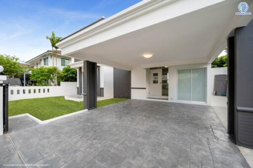 Modern house exterior with carport