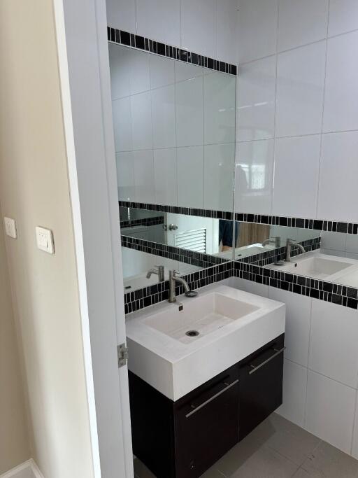 Modern bathroom with stylish vanity and large mirror