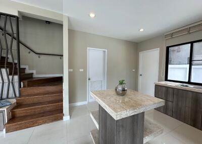 Modern kitchen with stair access and island