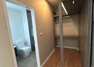 Hallway with view of bathroom and built-in wardrobe