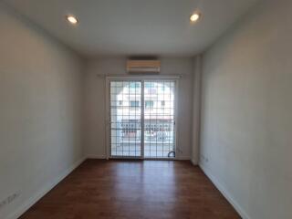 Living room with wooden floor and large sliding glass door