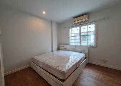 Spacious bedroom with large window