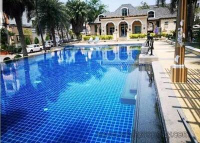 Beautiful outdoor swimming pool area with surrounding greenery