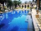 Beautiful outdoor swimming pool area with surrounding greenery