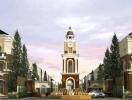 Exterior view of a stylish residential building with a tall clock tower