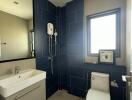 Modern bathroom with navy and beige tiles