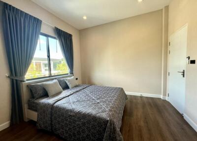 Bedroom with a large bed and window