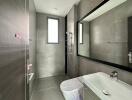 Modern bathroom with large mirror