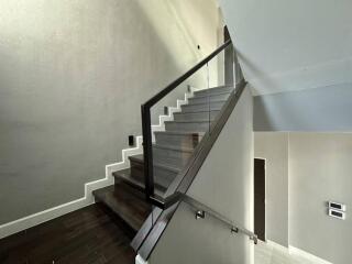 Modern staircase with glass railings