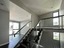 modern interior stairway with large windows