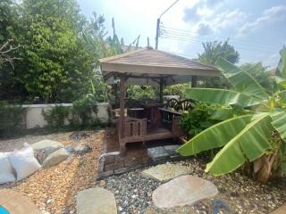 Outdoor patio with wooden gazebo