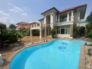 Exterior view of a luxury house with swimming pool