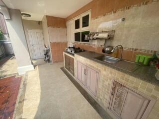 Outdoor kitchen with countertop and sink