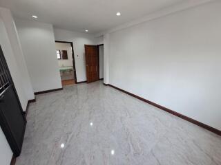 Spacious empty living room with marble flooring
