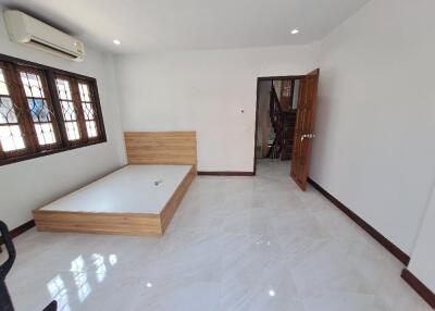 Spacious unfurnished bedroom with natural light