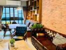 Cozy and modern living room with brick walls, large windows, comfortable seating, and wooden furniture.