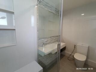 Modern bathroom with glass shower and toilet