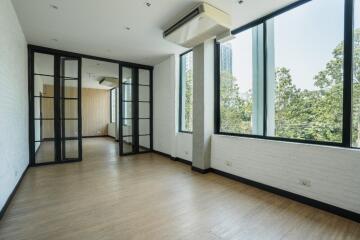 Spacious, well-lit living room with large windows and modern design