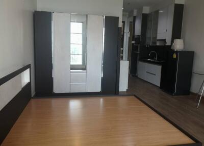 Bedroom with wooden floor and built-in wardrobe