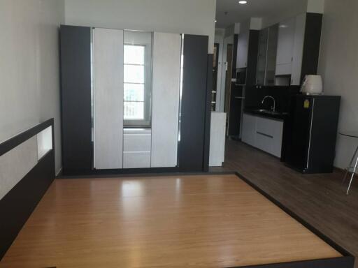 Bedroom with wooden floor and built-in wardrobe